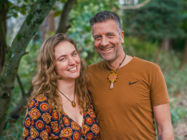 Hosts of Happie Together Festival demonstrating Shibari as a practice for connection, holding space with care in a welcoming, safe, and sensual environment.