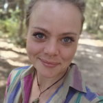 Portrait of a facilitator offering yoni steam and gentle guidance at the Happie Together Festival, creating a calm and nurturing healing space.