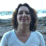 Portrait of an embodiment and shadow work facilitator at the Happie Together Festival, holding grounded presence in a safe and welcoming space.